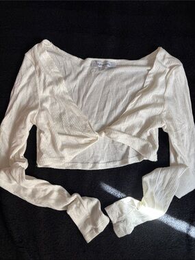 OOTDFash Ivory Ribbed Twist-Front Long Sleeve Crop Top